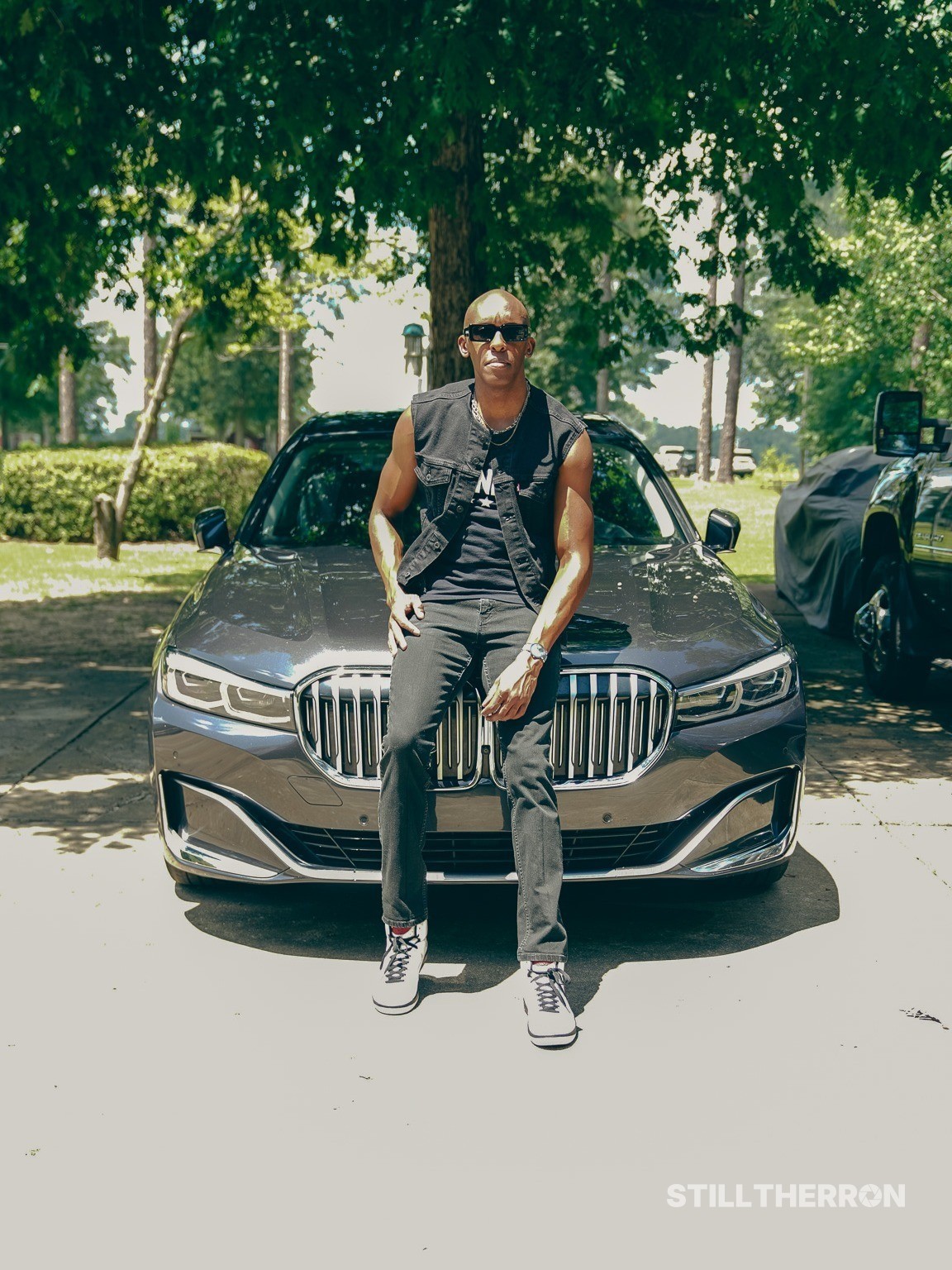 Posing next to a car