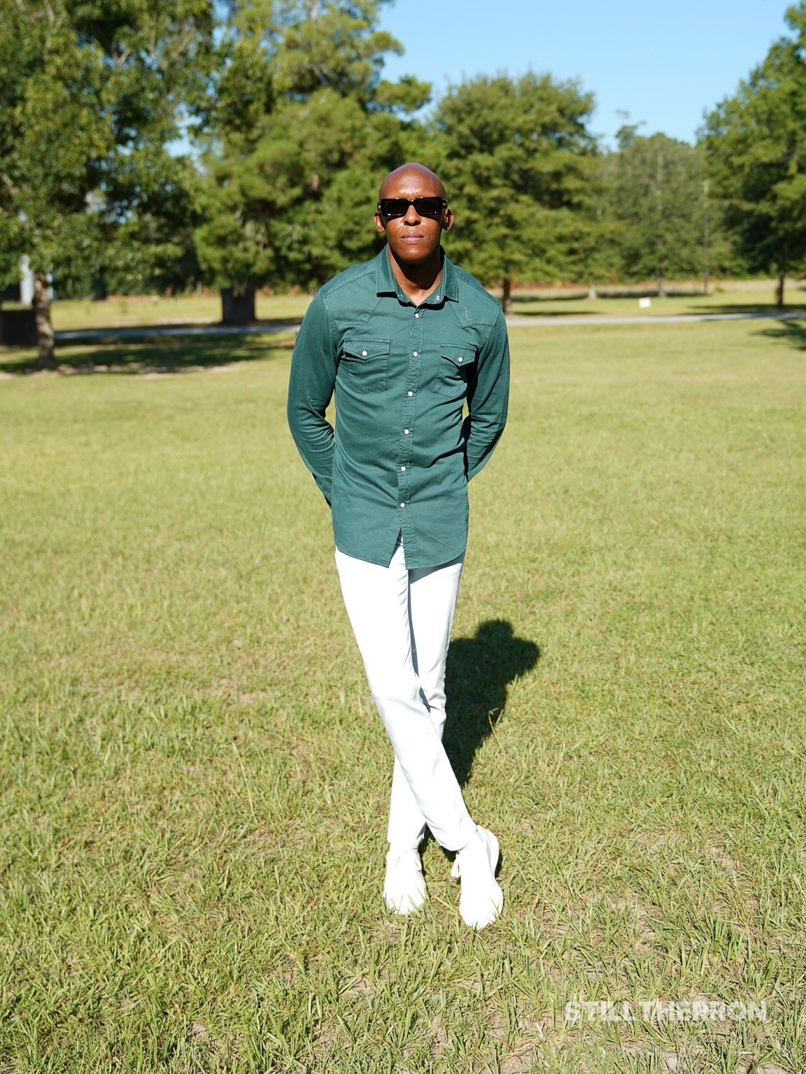 Posing in a field of green