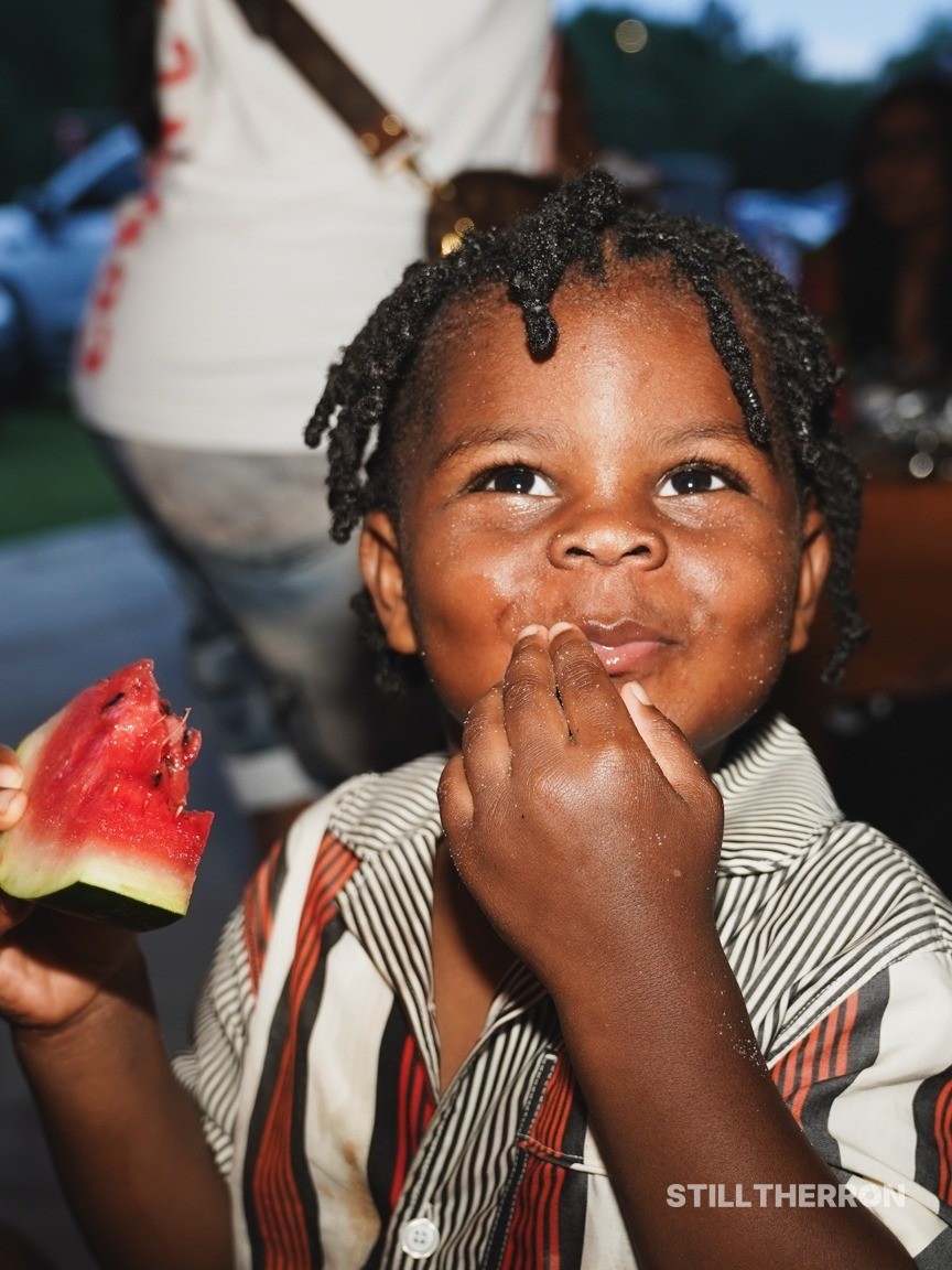 A child enjoying his watermelon.