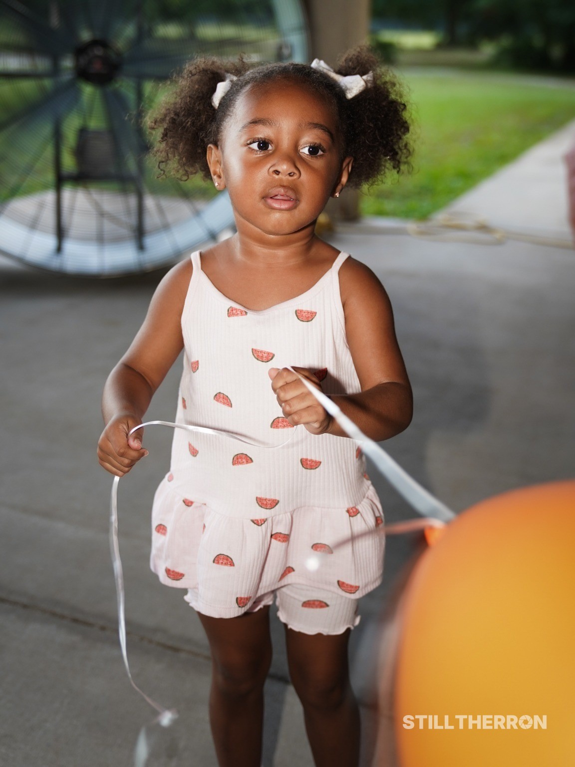 A child holding a balloon.